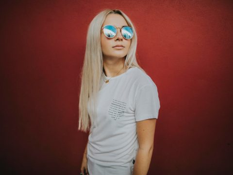 Photo of Woman Wearing Blue-lens Sunglasses