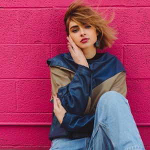 Shallow Focus Photo of Woman In Navy-blue and Brown Jacket Photo