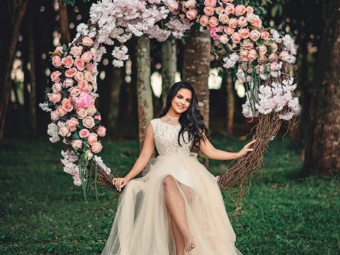 Woman Wearing White Dress Sitting On Swing