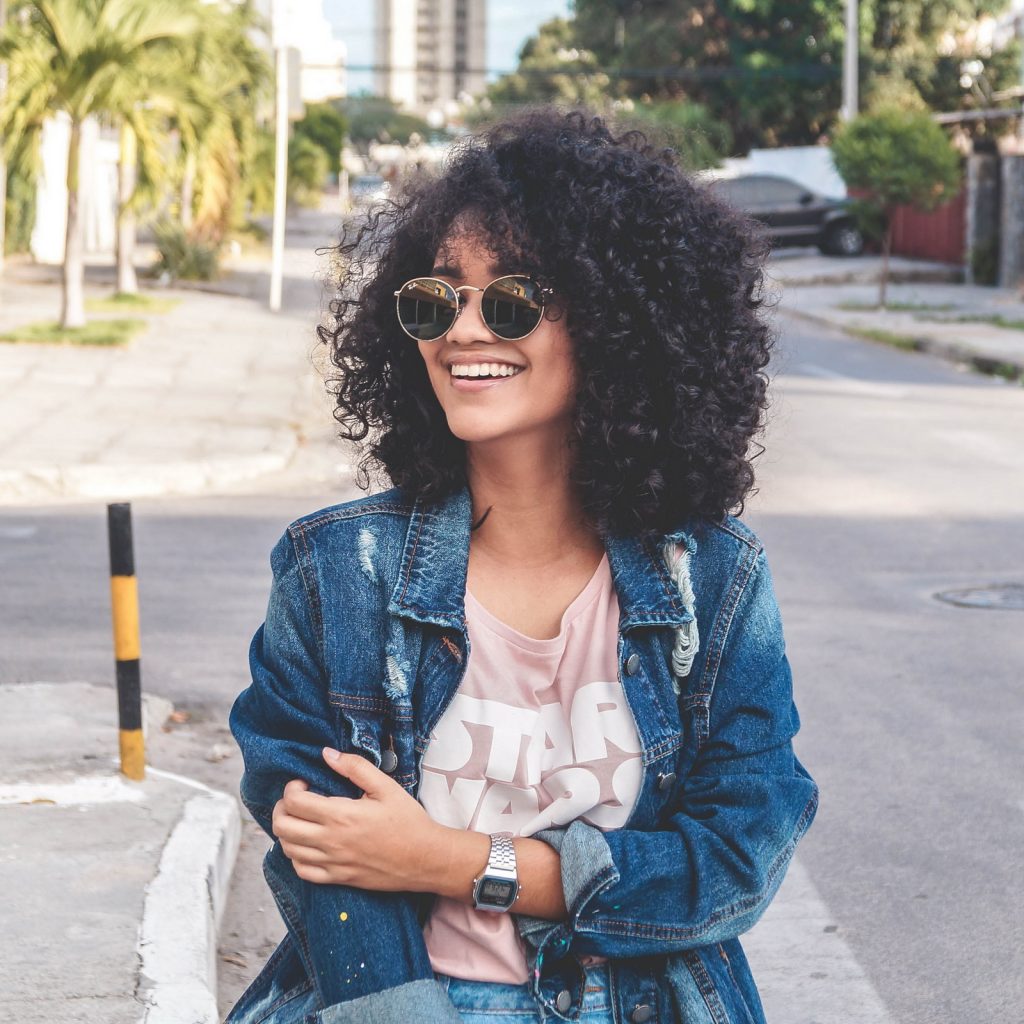 Woman is Wearing Blue Denim Jacket Standing on The Street