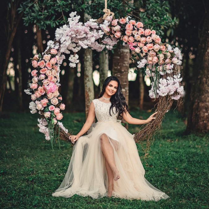 Woman Wearing White Dress Sitting On Swing